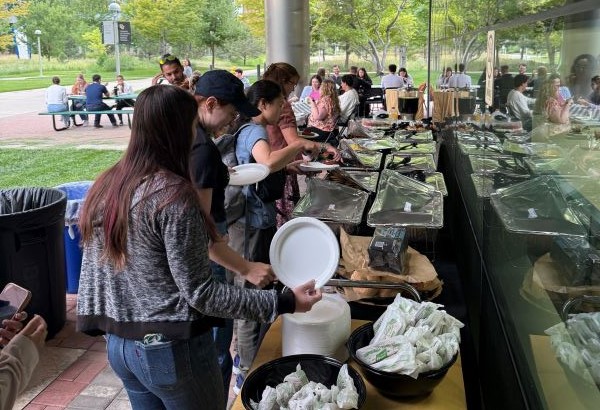 Grad School Griddle attendees grab food