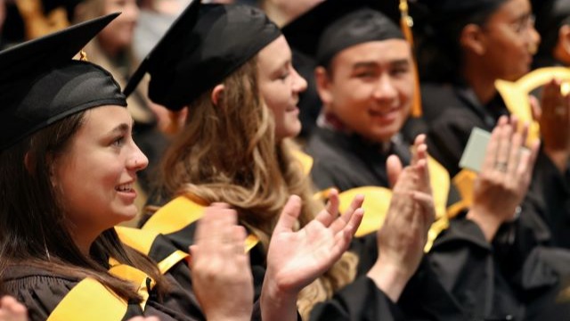 CU Anschutz Graduates in Regalia at a Spring Convcocation